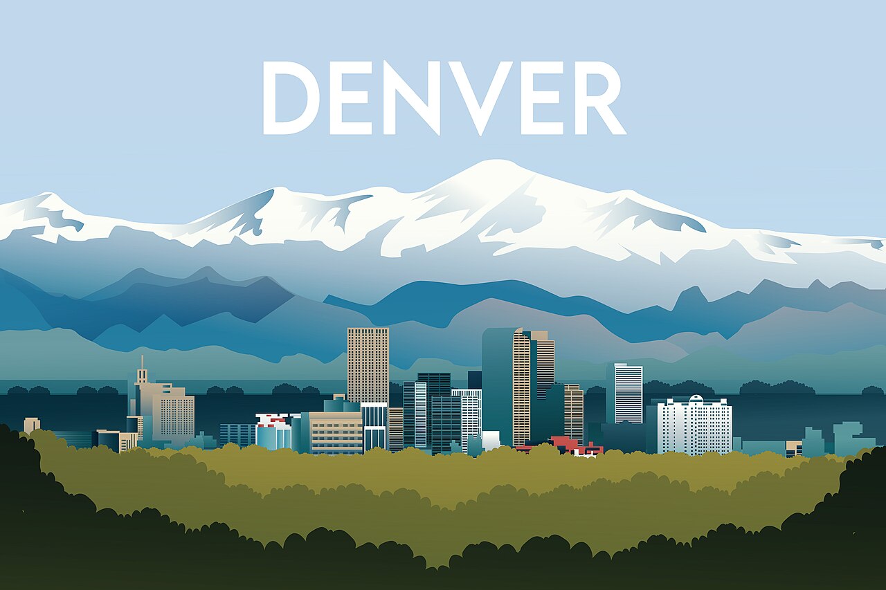 Denver, Colorado skyline below the snow-capped Rocky Mountains
